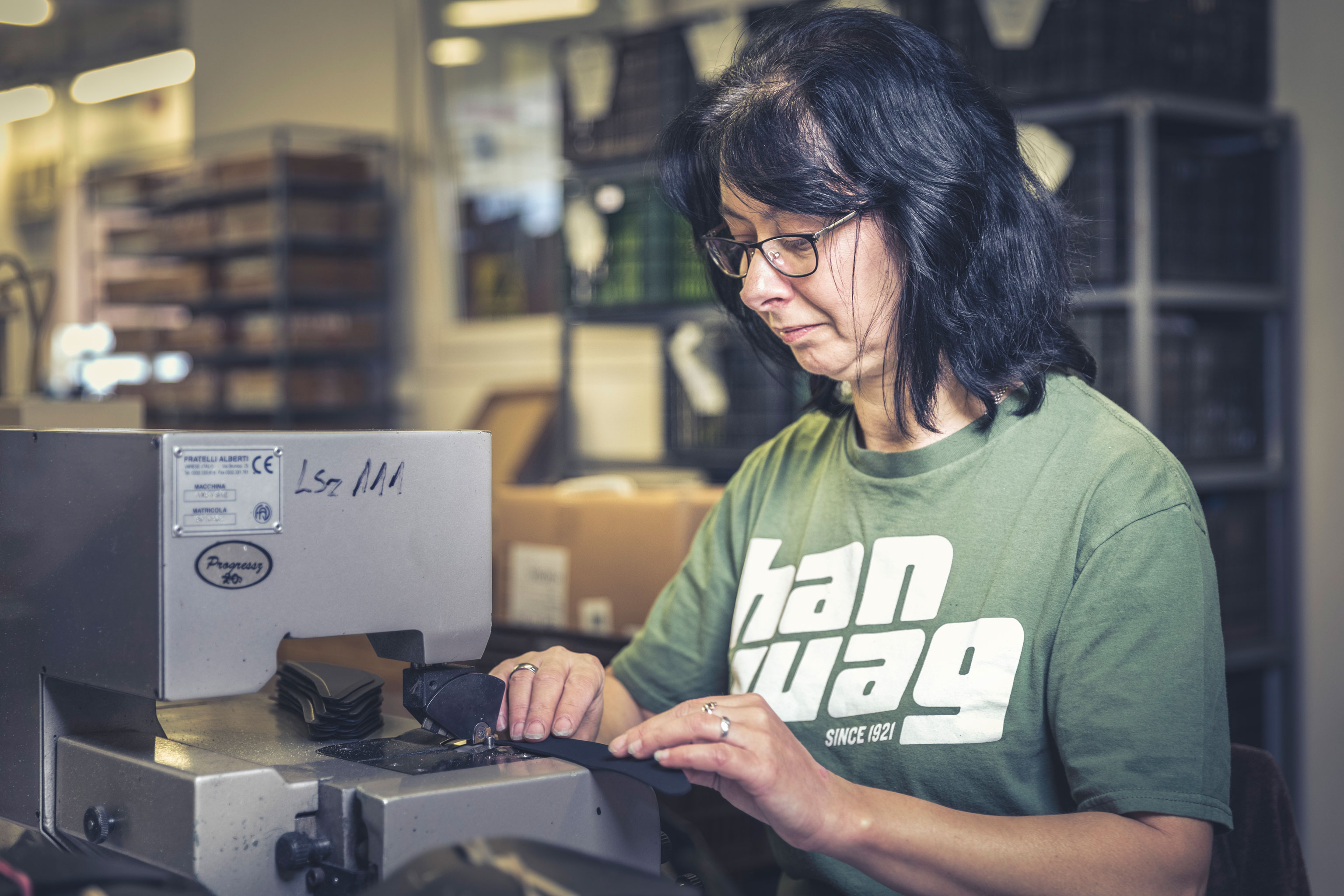 Andrea processes rubber pieces at the Hanwag good hiking boots production site in Hungary