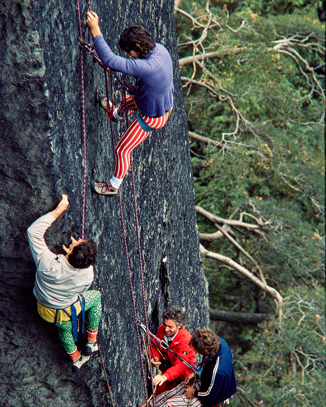 Four climbers hanging in a rockface in the Elbsandstein area in the 1990s