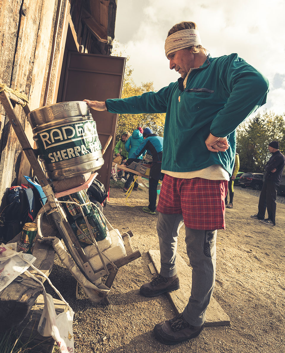 A Tatra Sherpa securing a barrel to his frame pack