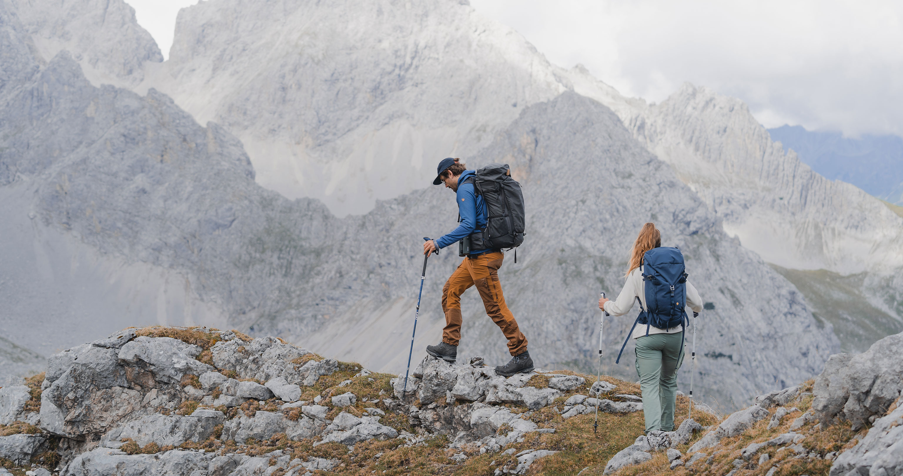 A couple hiking in the mountains wearing Hanwag Tatra II trekking boots
